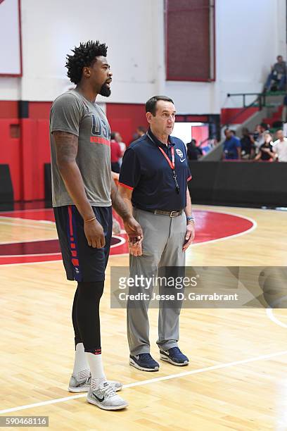 DeAndre Jordan and head coach Mike Krzyzewski of the USA Basketball Men's National Team talk at a practice during the Rio 2016 Olympic Games on...