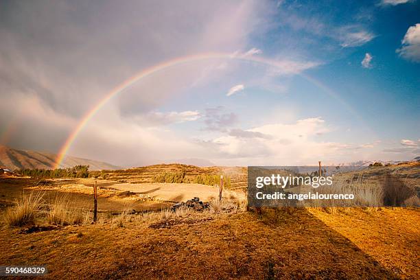 rainbow in cusco, peru - peru mountains stock-fotos und bilder