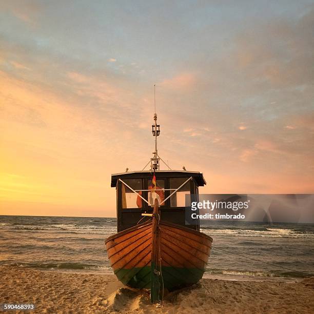 close-up of a wooden boat on beach, baltic sea, germany - wooden boat stock pictures, royalty-free photos & images