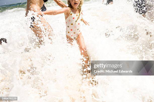 east hampton beach - mature woman in water stock pictures, royalty-free photos & images