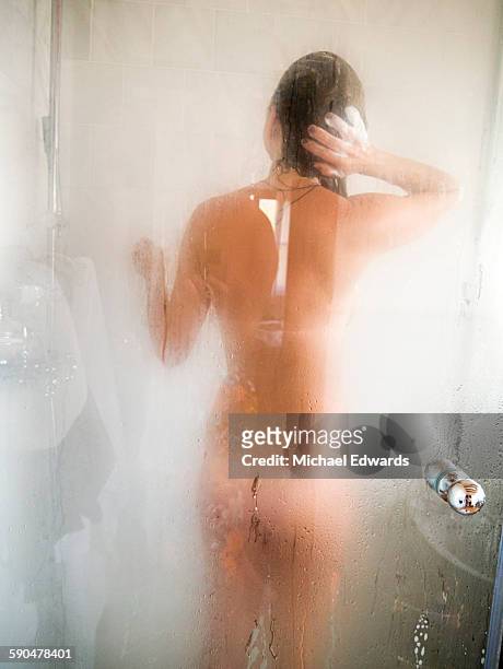 woman in shower - bare bum stock pictures, royalty-free photos & images