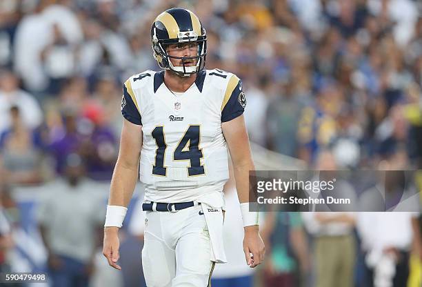 Quarterback Sean Mannion of the Los Angeles Rams looks to the sideline in the game against the Dallas Cowboys at the Los Angeles Coliseum during...