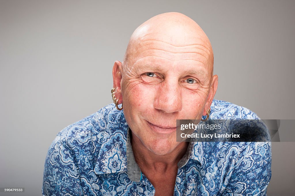 Studio portrait of a mature bald man