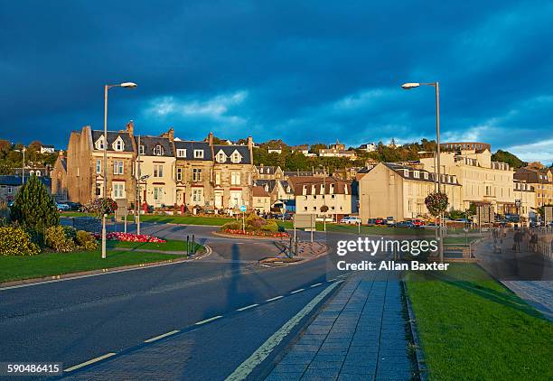 skyline of oban and sunset - oban scotland stock pictures, royalty-free photos & images