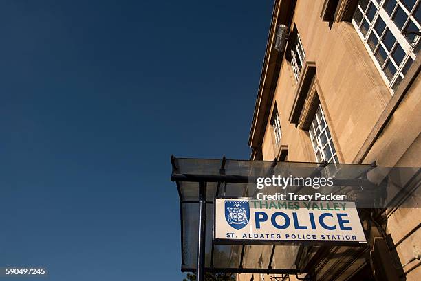 View looking up at the entrance canopy and sign for Thames Valley Police at the police station on St Aldates in the University City of Oxford, UK.