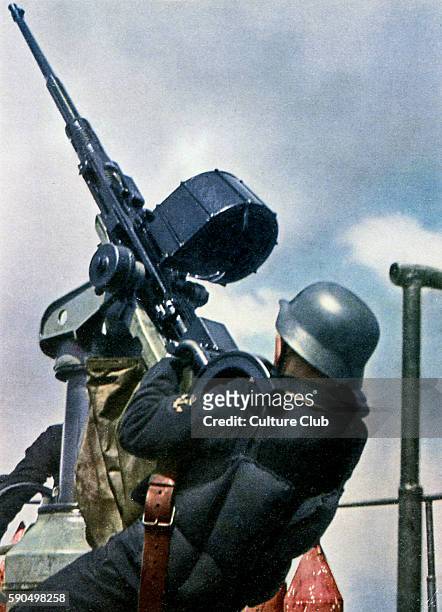 Eastern Front. Protection from air attack. Gunner at sea pointing weapon into the sky.