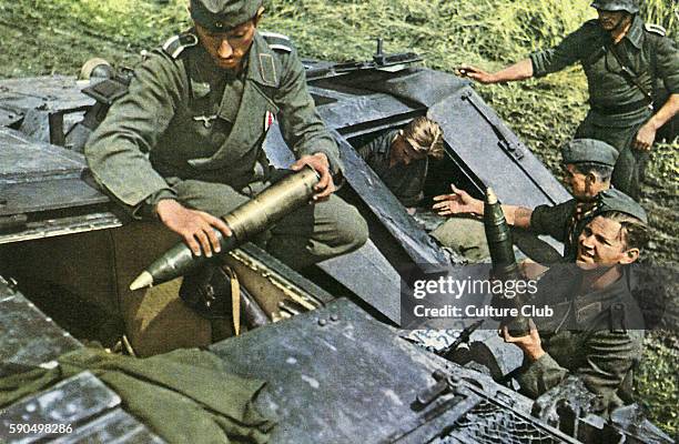 Eastern Front. Soldiers load an assault cannon with ammunition.