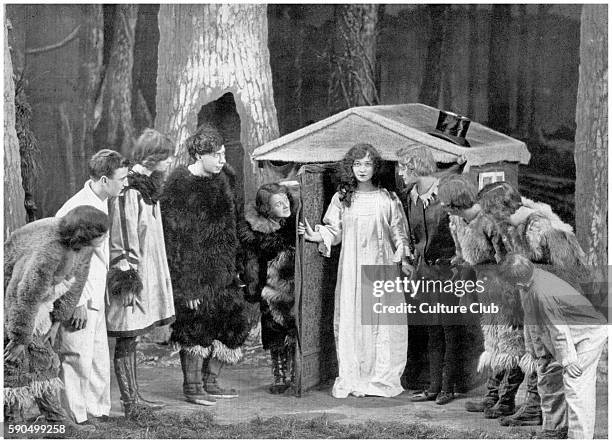 Barrie 's Peter Pan, music by John Crook, at the Vaudeville Theatre, Paris. Act II - Neverland. Left to right: Winifred Geoghegan as Curly; George...