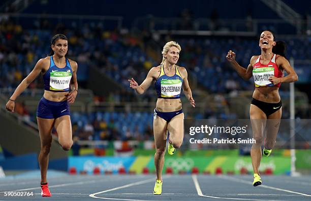 Jenna Prandini of the United States, Natalia Pohrebniak of Ukraine and Ivet Lalova-Collio of Bulgaria compete during the Women's 200m Semifinals on...