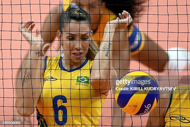 Brazil's Thaisa Menezes eyes the ball during the women's quarter-final volleyball match between Brazil and China at the Maracanazinho stadium in Rio...