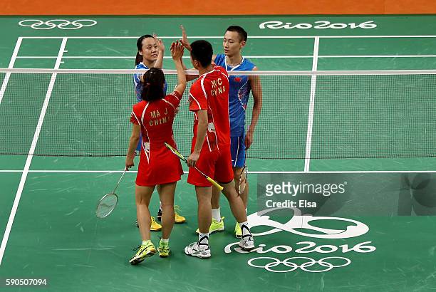 Yunlei Zhao and Nan Zhang of China are congratulated for their bronze medal Mixed Doubles win by Chen Xu and Jin Ma of China on Day 11 of the Rio...