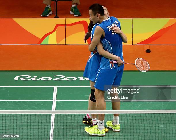 Yunlei Zhao and Nan Zhang of China celebrate their bronze medal Mixed Doubles match against Chen Xu and Jin Ma of China on Day 11 of the Rio 2016...