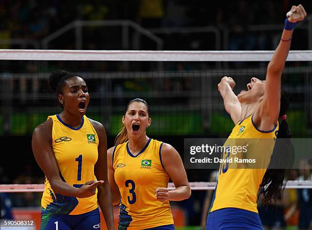 Fabiana Claudino, Danielle Lins and Sheilla Castro de Paula Blassioli of Brazil react during the Women's Quarterfinal match between China and Brazil...