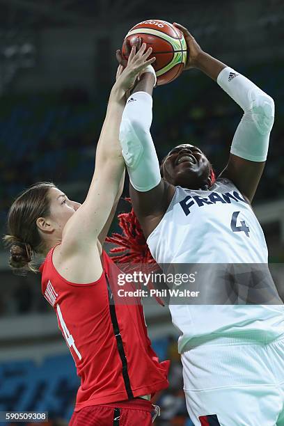 Isabelle Yacoubou of France and Katherine Plouffe of Canada contest the ball during the Women's Quarterfinal match between France and Canada at...