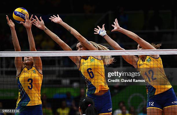 Danielle Lins, Thaisa Menezes and Natalia Pereira of Brazil in action during the Women's Quarterfinal match between China and Brazil on day 11 of the...