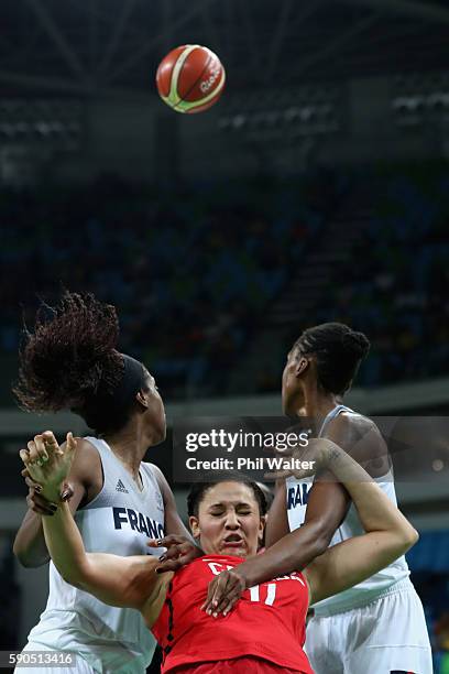 Natalie Achonwa of Canada is squeezed by the French defence during the Women's Quarterfinal match between France and Canada at Carioca Arena 1 on...