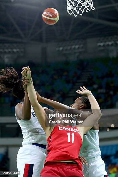 Natalie Achonwa of Canada is squeezed by the French defence during the Women's Quarterfinal match between France and Canada at Carioca Arena 1 on...