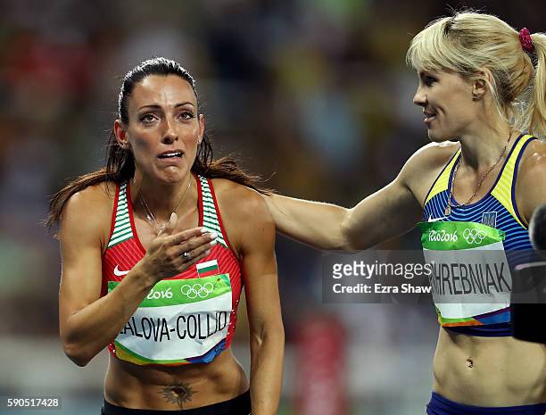 Ivet Lalova-Collio of Bulgaria and Natalia Pohrebniak of Ukraine react during the Women's 200m Semifinals on Day 11 of the Rio 2016 Olympic Games at...