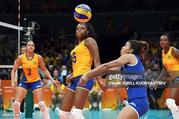 Brazil's Danielle Lins, Fernanda Rodrigues, Leia Da Silva Nicolosi and Fabiana Claudino compete during the women's quarter-final volleyball match...