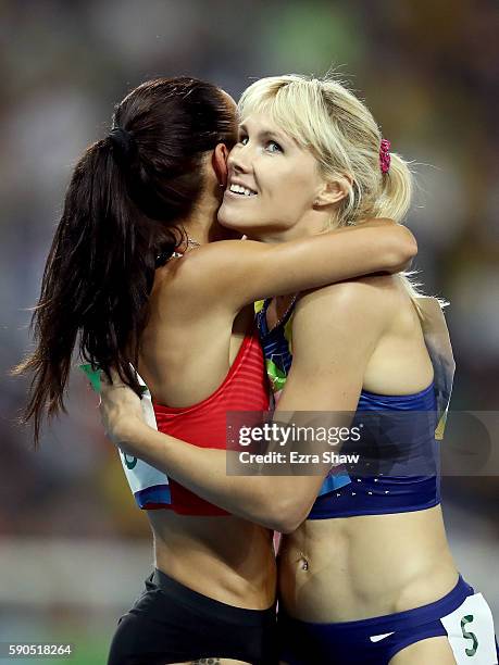 Ivet Lalova-Collio of Bulgaria and Natalia Pohrebniak of Ukraine hug during the Women's 200m Semifinals on Day 11 of the Rio 2016 Olympic Games at...