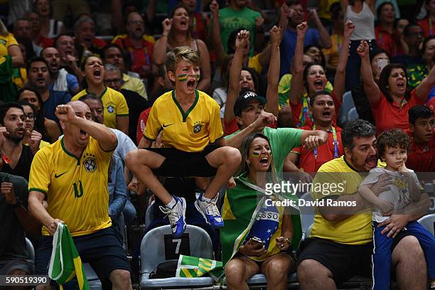 Fans of Brazil cheer on their team during the Women's Quarterfinal match between China and Brazil on day 11 of the Rio 2106 Olympic Games at the...