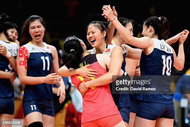Players of China celebrate defeating Brazil during the Women's Quarterfinal match between China and Brazil on day 11 of the Rio 2106 Olympic Games at...