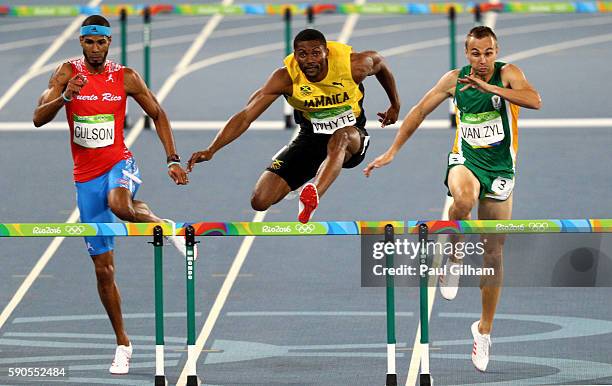 Javier Culson of Puerto Rico, Annsert Whyte of Jamaica and L.J. Van Zyl of South Africa compete during the Men's 400m Hurdles semifinals on Day 11 of...