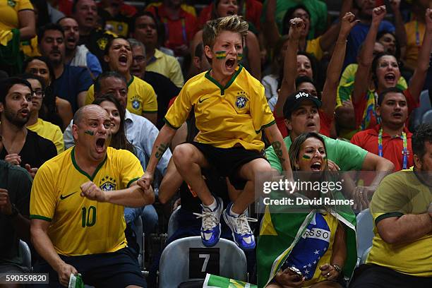 Fans of Brazil cheer on their team during the Women's Quarterfinal match between China and Brazil on day 11 of the Rio 2106 Olympic Games at the...