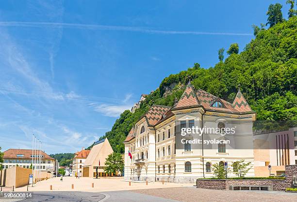 the parliament building with vaduz castle - liechtenstein cityscape stock pictures, royalty-free photos & images