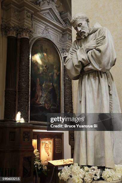 statue of francis of assisi in assisi cathedral - saint francis of assisi stock pictures, royalty-free photos & images