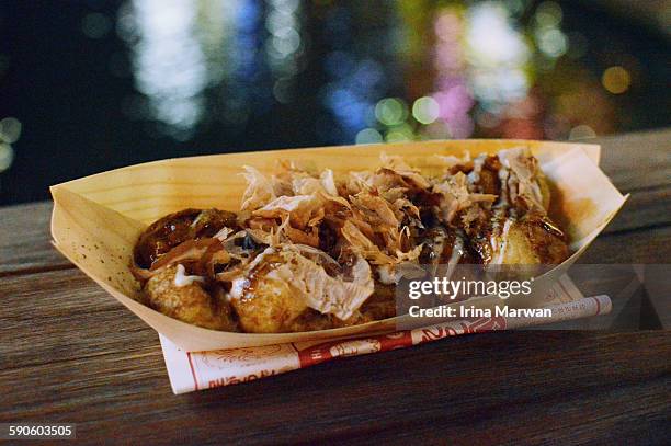takoyaki by the dotonbori-gawa - takoyaki stock pictures, royalty-free photos & images