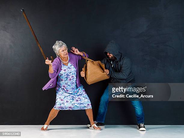 get your hands off my bag! - female gangster stock pictures, royalty-free photos & images