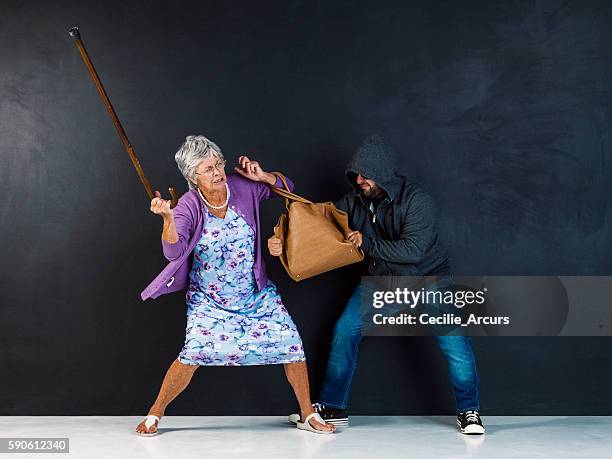 get your hands off my bag! - purse contents stock pictures, royalty-free photos & images