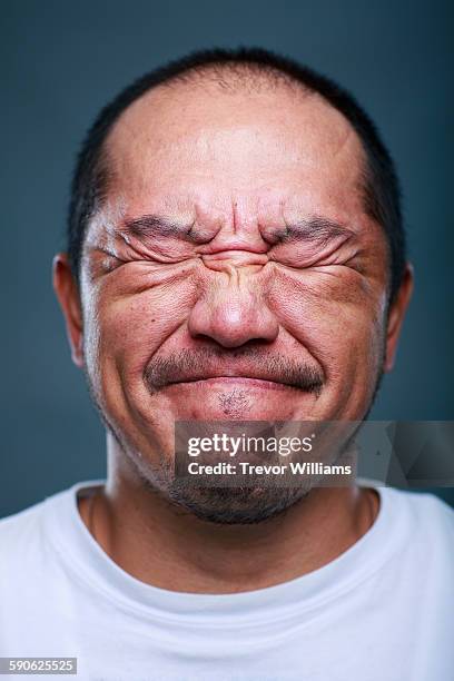 a japanese man in his 50's - eyes closed close up stock pictures, royalty-free photos & images