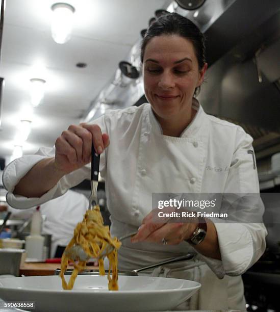 Chef Barbara Lynch prepares tagliatelle with meat sauce at restaurant No. 9 Park in Boston.