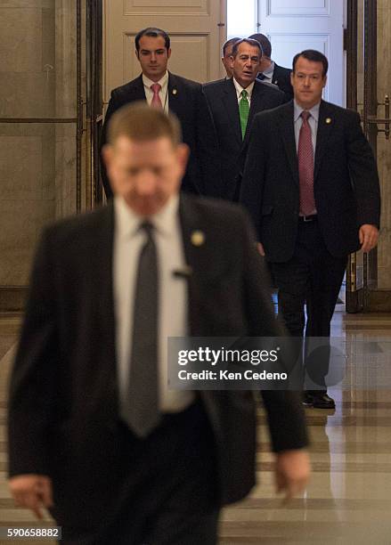 House Speaker John Boehner, , center rear, arrives at the U.S. Capitol in Washington, D.C., on Tues Jan 1, 2013. U.S. Lawmakers worked hard toward a...