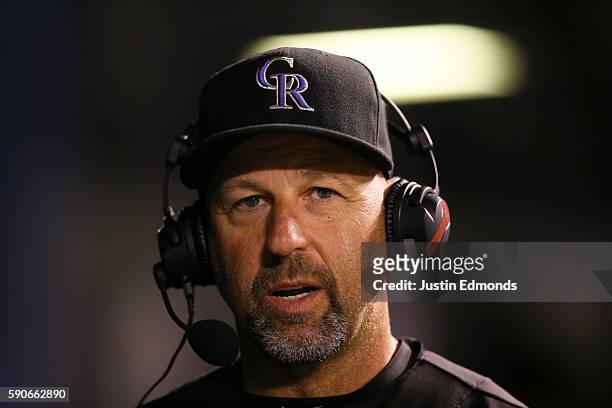 Manager Walt Weiss of the Colorado Rockies speaks with the broadcast team during the fourth inning against the Washington Nationals at Coors Field on...