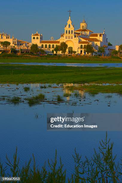 El Rocio village and Hermitage at Sunset, Almonte, El Rocio, Marismas de Donana, Donana National Park, Huelva province, Andalusia Spain.