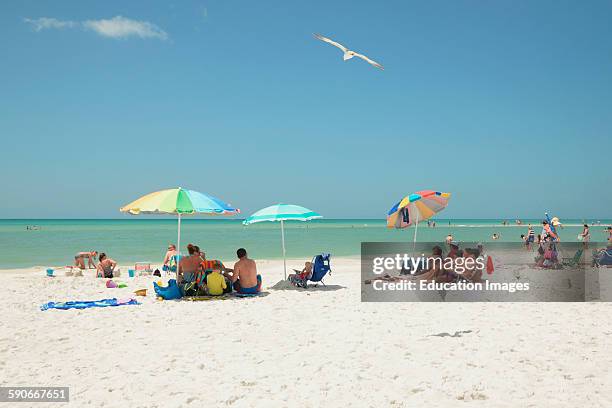 Beach goers and sun worshipers enjoy the sand and the water of Siesta Key Beach in Sarasota, Florida. Siesta Key has been name to top beach in the...