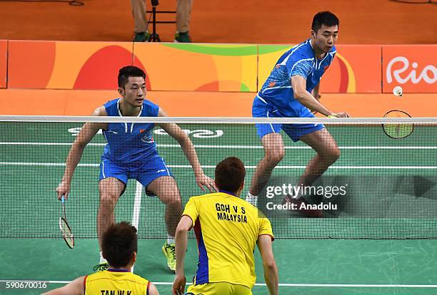 Chai Biao and Hong Wei of China compete against Goh V Shem and Tan Wee Kiong of Malaysia in the Mens Doubles Semi-final on Day 11 of the 2016 Rio...