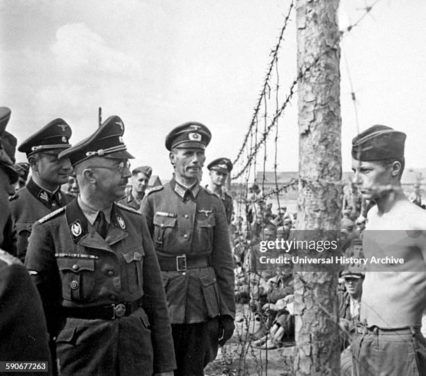 Chief Heinrich Himmler walks through a t prisoner of war camp for Russian prisoners of war.