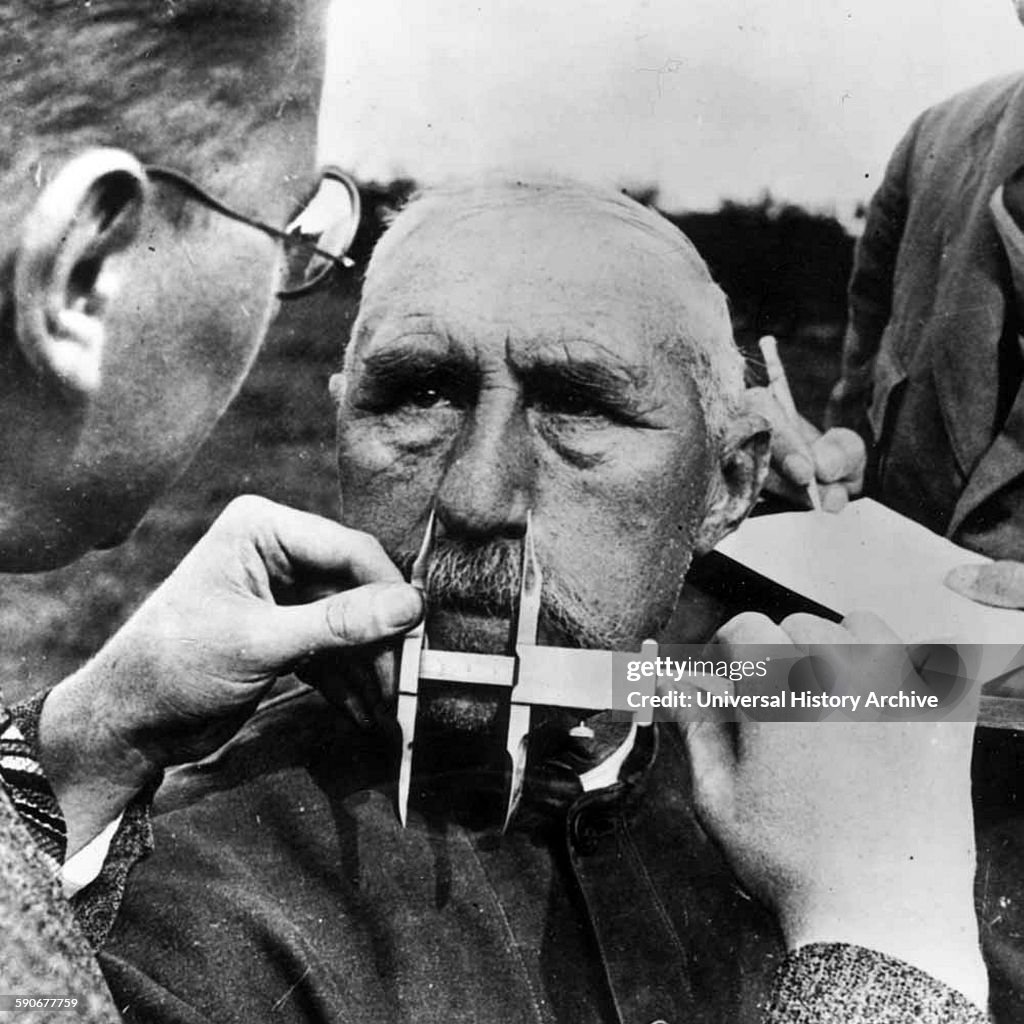 Aryan A man having his nose measured during Aryan race determination tests ...