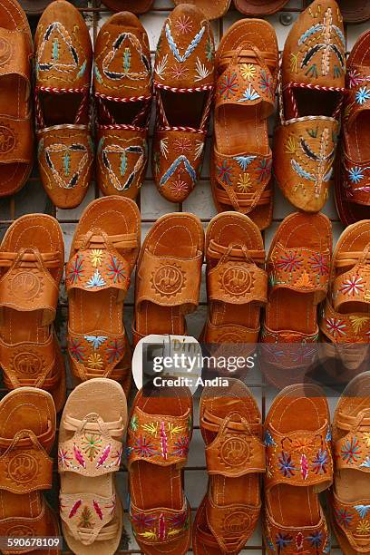 Babouches on display, souk in Monastir, street, shop window, craft industry -