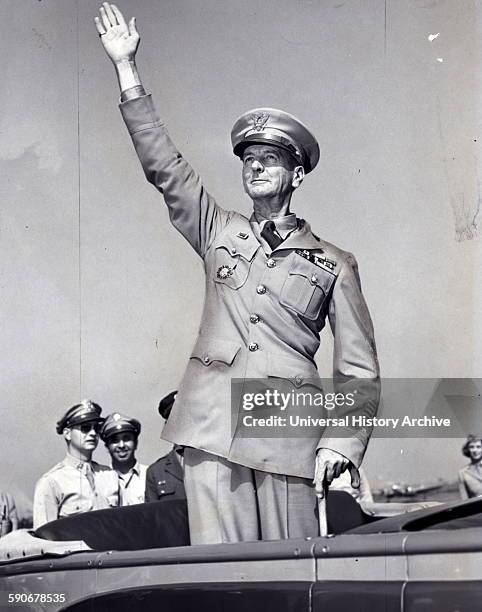 General Wainwright, standing in car, waving to crowd gathered at La Guardia field 1945. Jonathan Mayhew "Skinny" Wainwright IV was a career American...