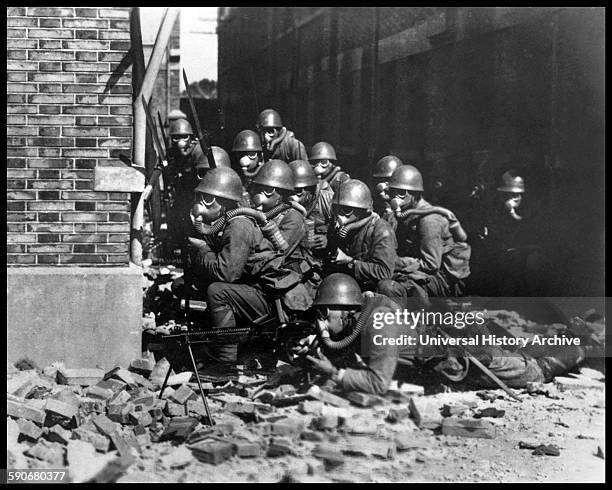 Photograph of Japanese Special Naval Landing Forces with gas masks and rubber gloves during a chemical attack, Battle of Shanghai. Dated 1937.