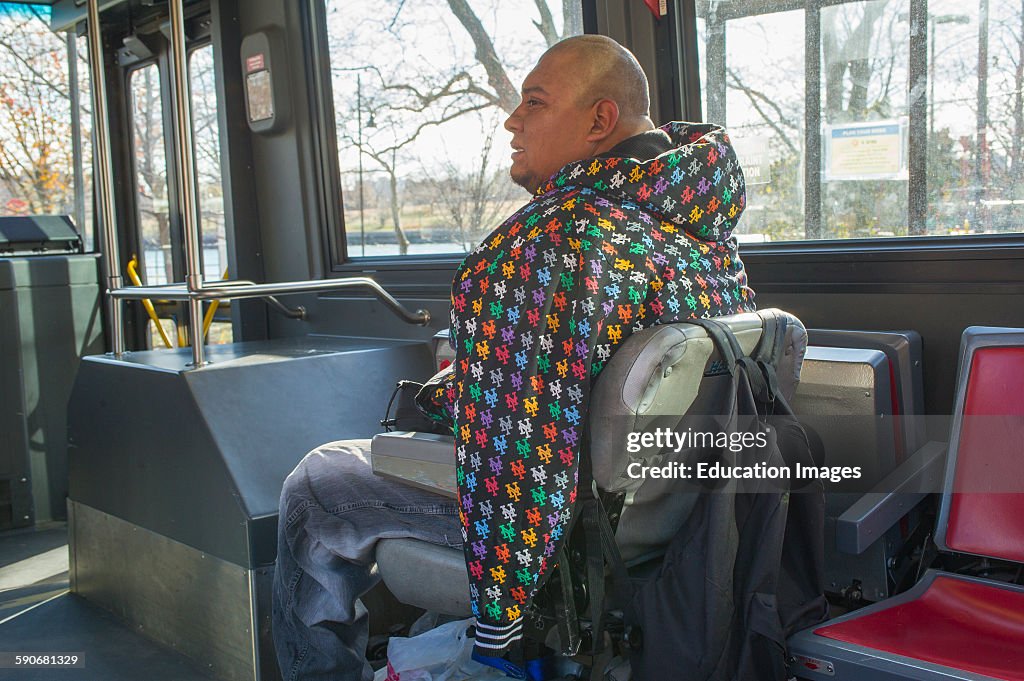 Handicapped man in wheelchair sitting on bus