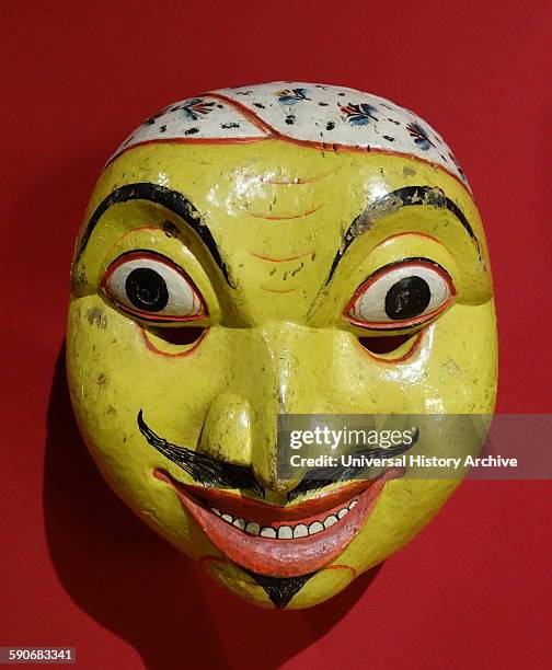 Kolam mask. Elaborate masks such as this were used by dancers to help act out a central theme during the ritualistic Kolam dances. Made from painted...