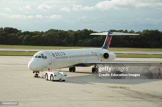 Push back a Delta Airways MD 88 leaving the stand at Tampa Florida USA.