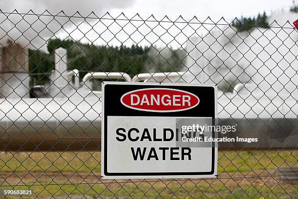 Danger notice on wire fence Scalding Water.
