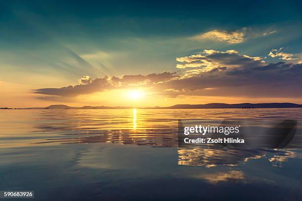 balaton lake and the sunset - sun flare clouds sky stock pictures, royalty-free photos & images